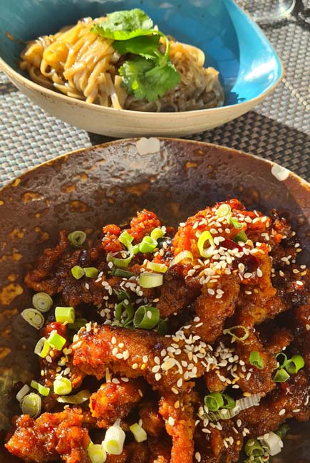 Sticky Chicken with Garlic Noodles at Giggling Squid, Brighton