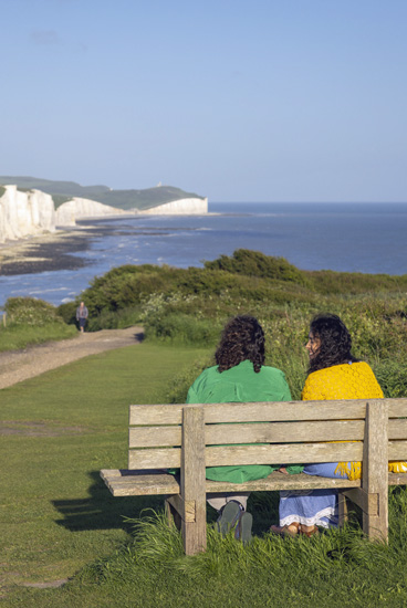 A couple enjoying the view at Seaford Head. Credit - James Ratchford