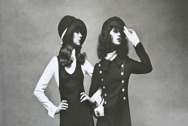 Image shows a black and white image of two people wearing Biba designs